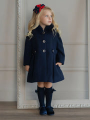 Girl wearing the Miranda button coat.