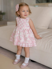 Baby girl modelling the Miranda floral print dress.