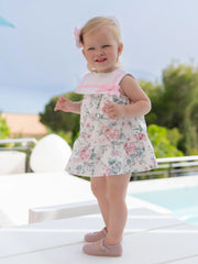 Baby girl wearing the Miranda floral print dress.