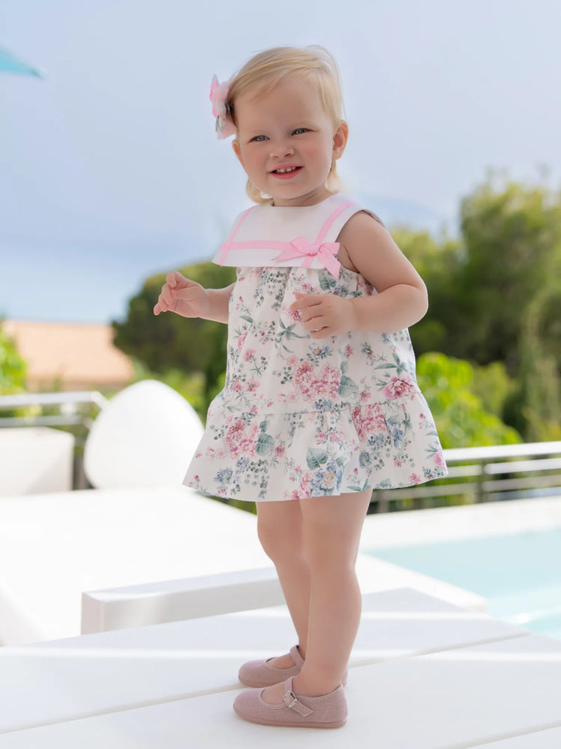 Baby girl wearing the Miranda floral print dress.