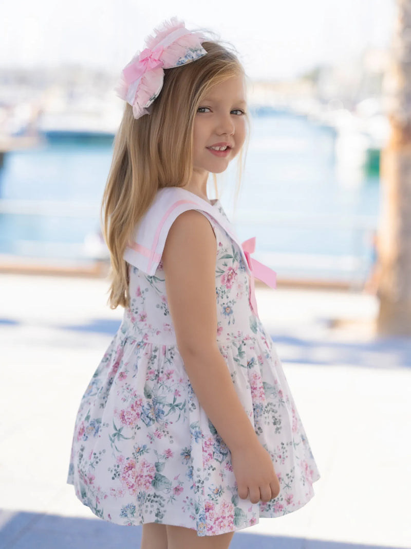 Side on view of the Miranda white floral print dress.