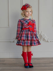 Girl wearing the Miranda plaid dress.