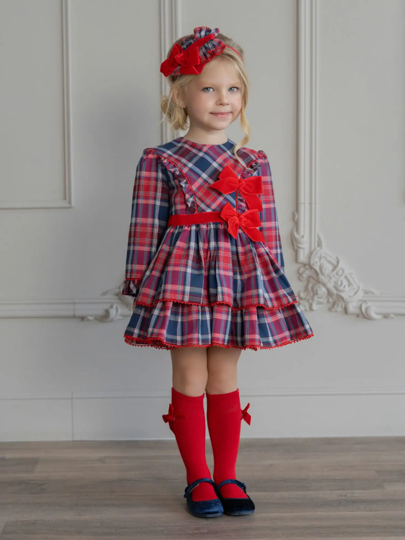 Girl wearing the Miranda plaid dress.