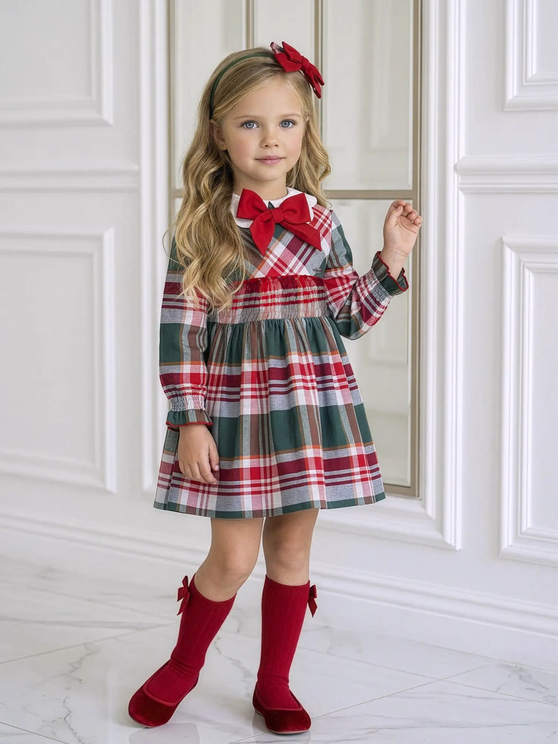 Girl modelling the Miranda plaid dress.