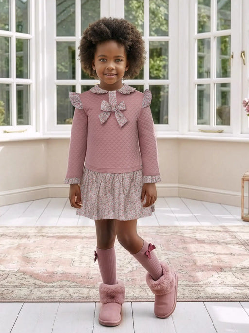 Girl modelling the Miranda quilted dress.