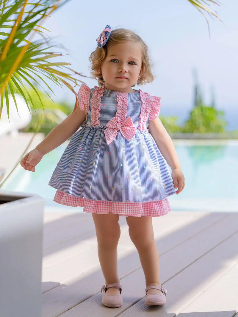 Baby girl modelling the Miranda striped dress.