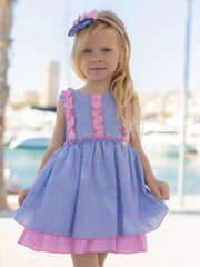 Girl modelling the Miranda striped dress.