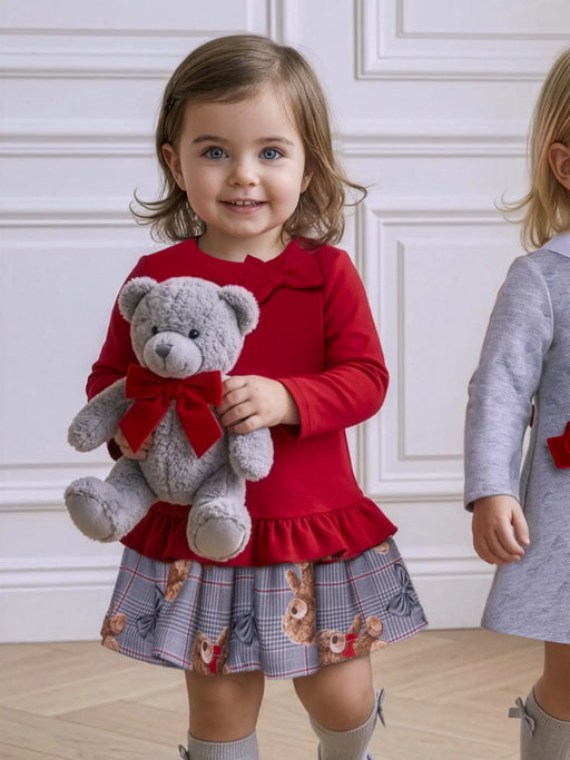 Girl wearing the Miranda teddy bear dress.