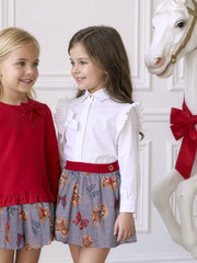 Girl modelling the Miranda teddy bear skirt set.