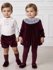 Baby girl wearing the Miranda velvet dress.