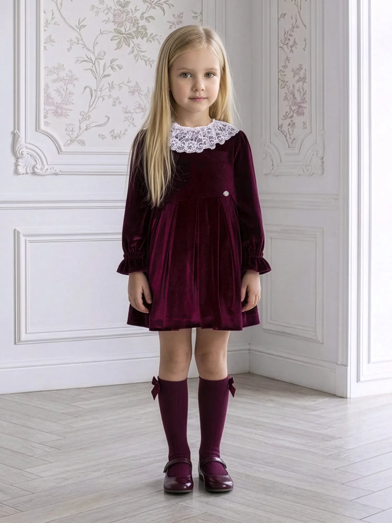 Girl modelling the Miranda velvet dress.