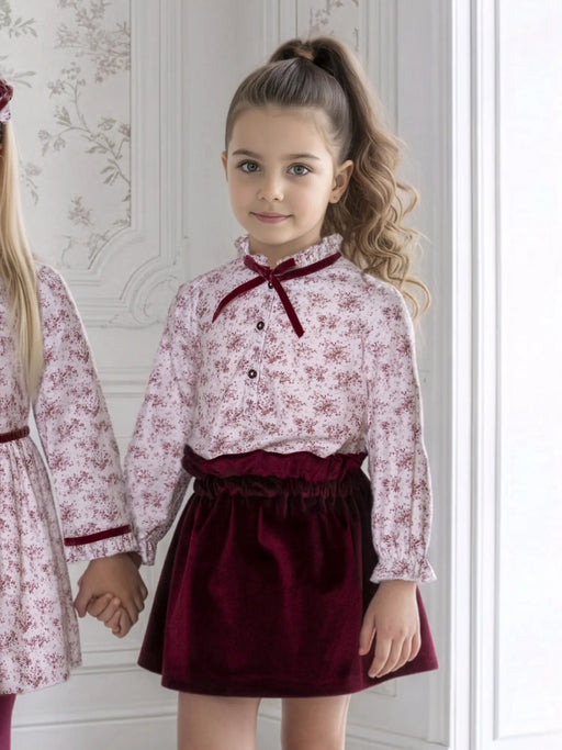 Girl wearing the Miranda velvet skirt set.