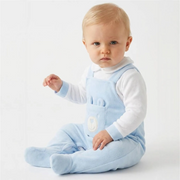 Baby boy wearing the Pex bear babygrow.