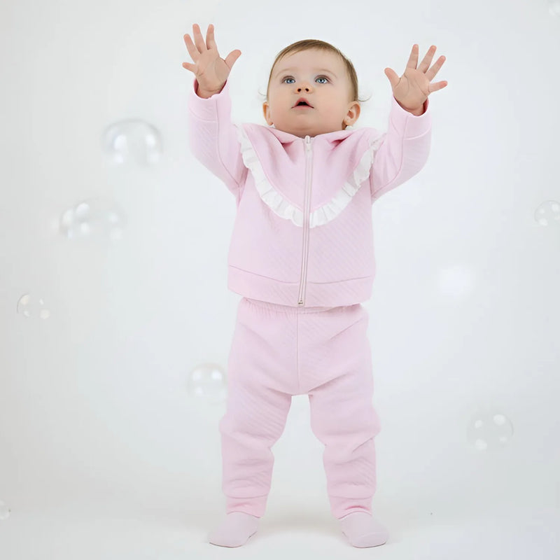 Baby girl wearing the Pex bianca tracksuit.