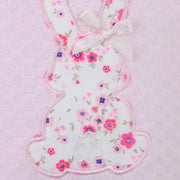 Closer look at the Pex floral bunny babygrow showing detail of the floral print bunny appliqué.