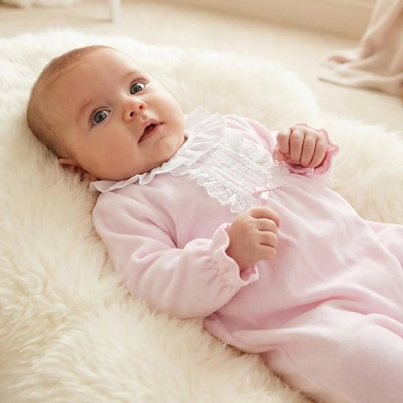 Baby girl wearing the Pex hannah babygrow.