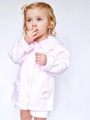 Baby girl wearing the Pex leila jacket.