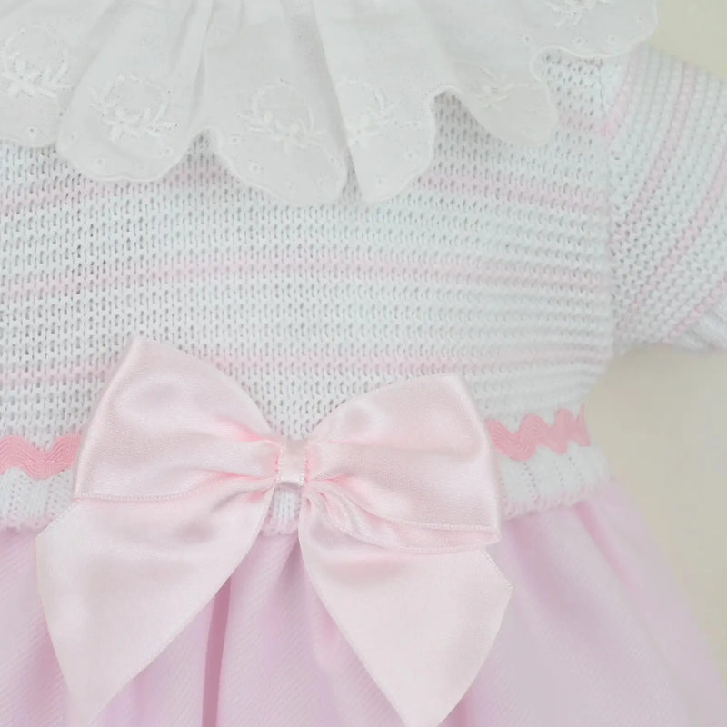 Closer look at the Pex tabitha dress showing detail of the pink ribbon bow on the front.