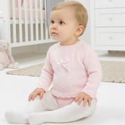 Baby girl wearing the Pex tilda leg warmer set.