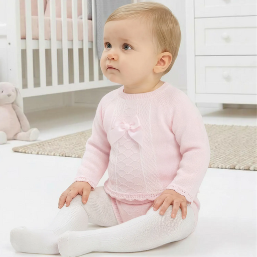 Baby girl wearing the Pex tilda leg warmer set.