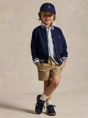 Boy wearing the Ralph Lauren baseball jacket.