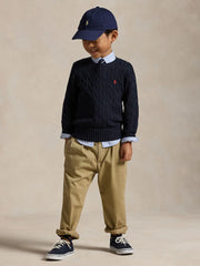 Boy modelling the Ralph Lauren cable knit sweater.