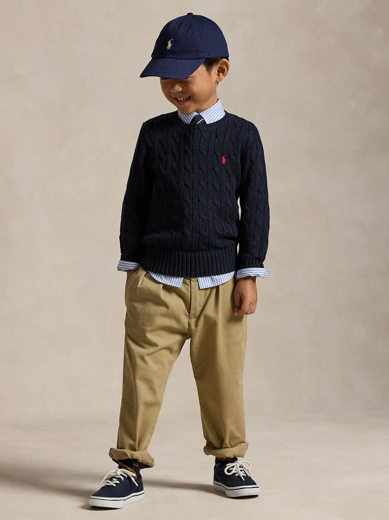 Boy modelling the Ralph Lauren cable knit sweater.