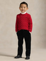 Boy modelling the Ralph Lauren cable knit sweater.