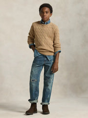 Boy in brown cable knit sweater by Ralph Lauren.