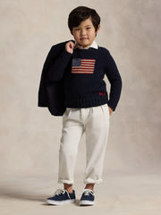 Boy modelling the Ralph Lauren flag sweater.