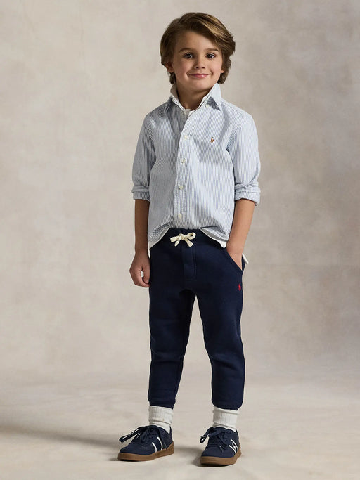 Smiling Boy modelling the Ralph Lauren fleece joggers.