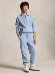 Boy modelling the Ralph Lauren half zip sweatshirt.