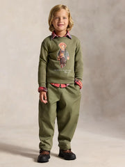 Smiling Boy modelling the Ralph Lauren polo bear sweatshirt.