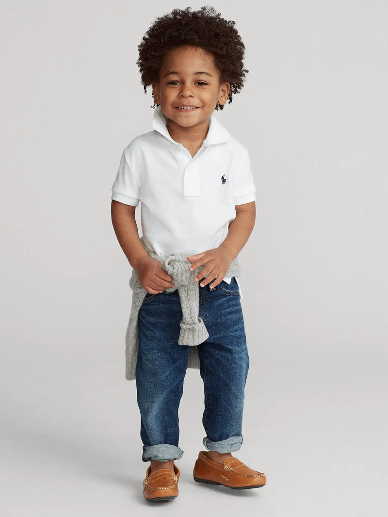 Smiling boy modelling the Ralph Lauren polo shirt.