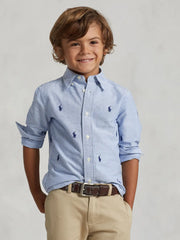 Boy modelling the Ralph Lauren pony shirt.