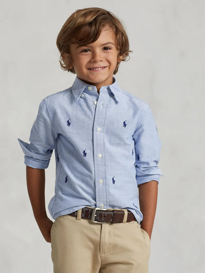 Boy modelling the Ralph Lauren pony shirt.