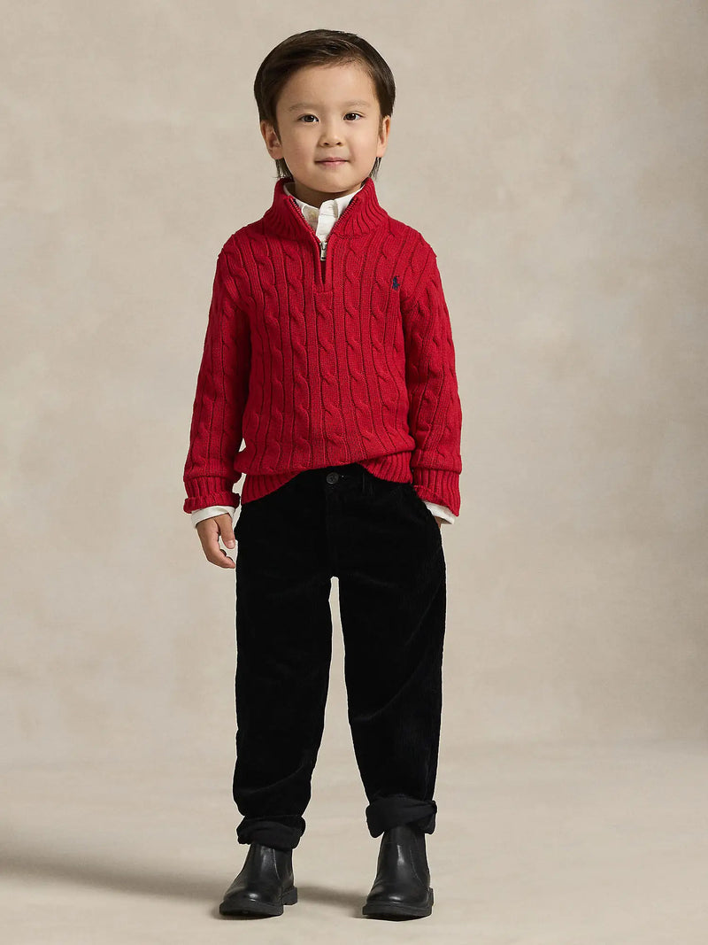 Boy wearing the Ralph Lauren quarter zip jumper.