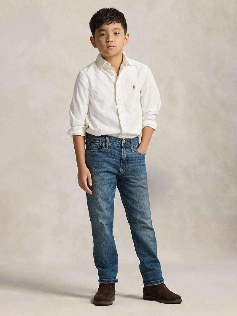Boy in blue sullivan slim stretch jeans by Ralph Lauren.