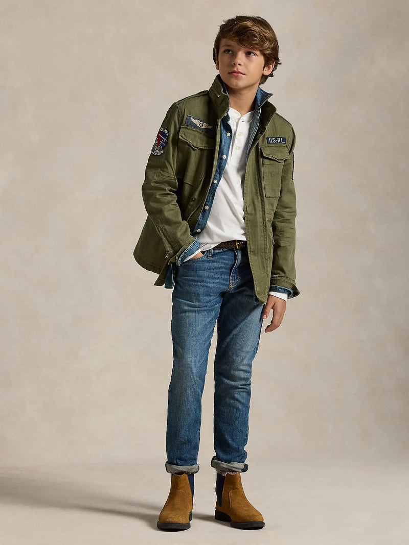 Boy modelling the Ralph Lauren sullivan stretch jeans.