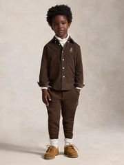 Boy modelling the Ralph Lauren fleece joggers.