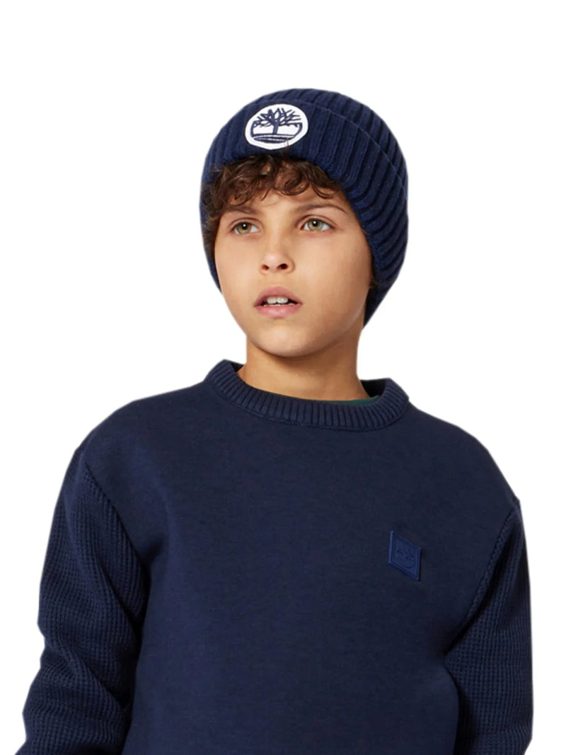 Boy wearing the Timberland beanie hat.