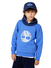 Boy modelling the Timberland logo hoodie.