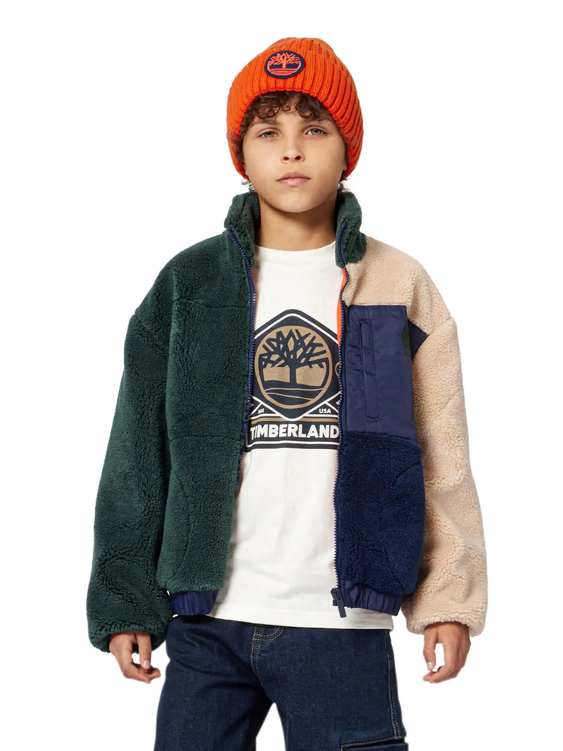 Boy wearing the Timberland logo t-shirt.