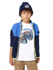 Boy wearing the Timberland logo t-shirt.