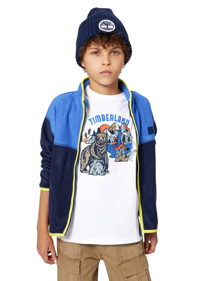 Boy wearing the Timberland logo t-shirt.