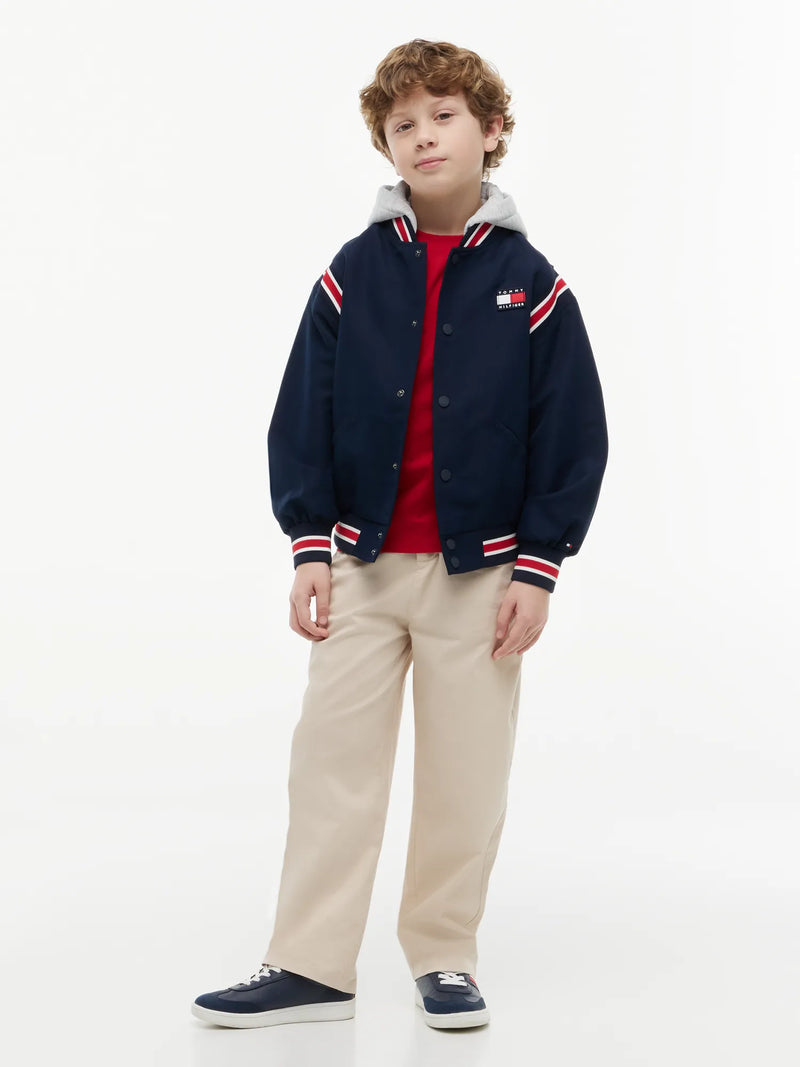 Boy modelling the Tommy Hilfiger bomber jacket.