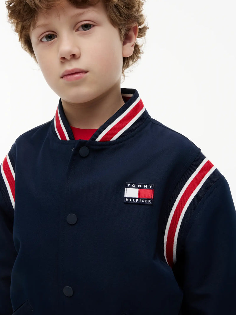 Tommy Hilfiger bomber jacket with flag logo patch on the chest.