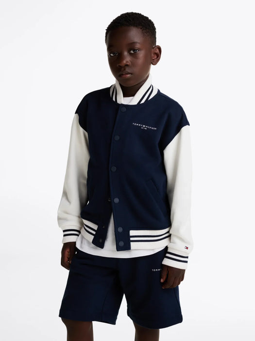 Boy modelling the Tommy Hilfiger bomber jacket.