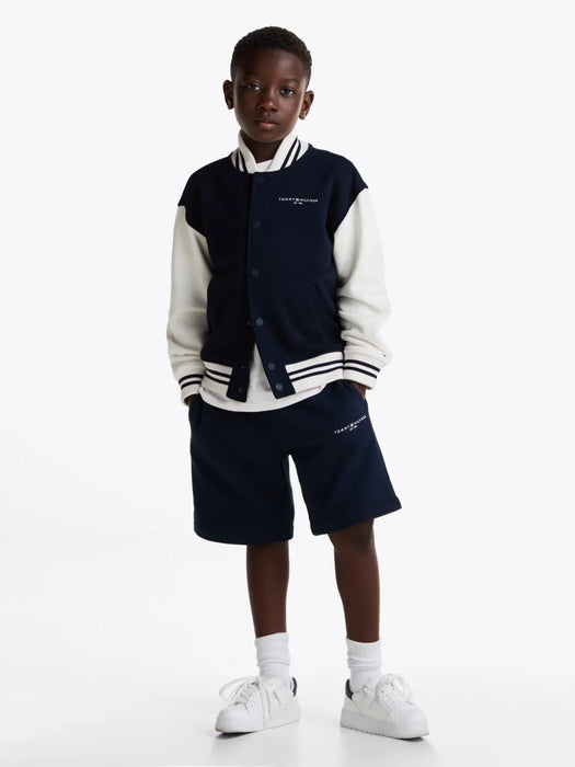 Boy wearing the Tommy Hilfiger bomber jacket.