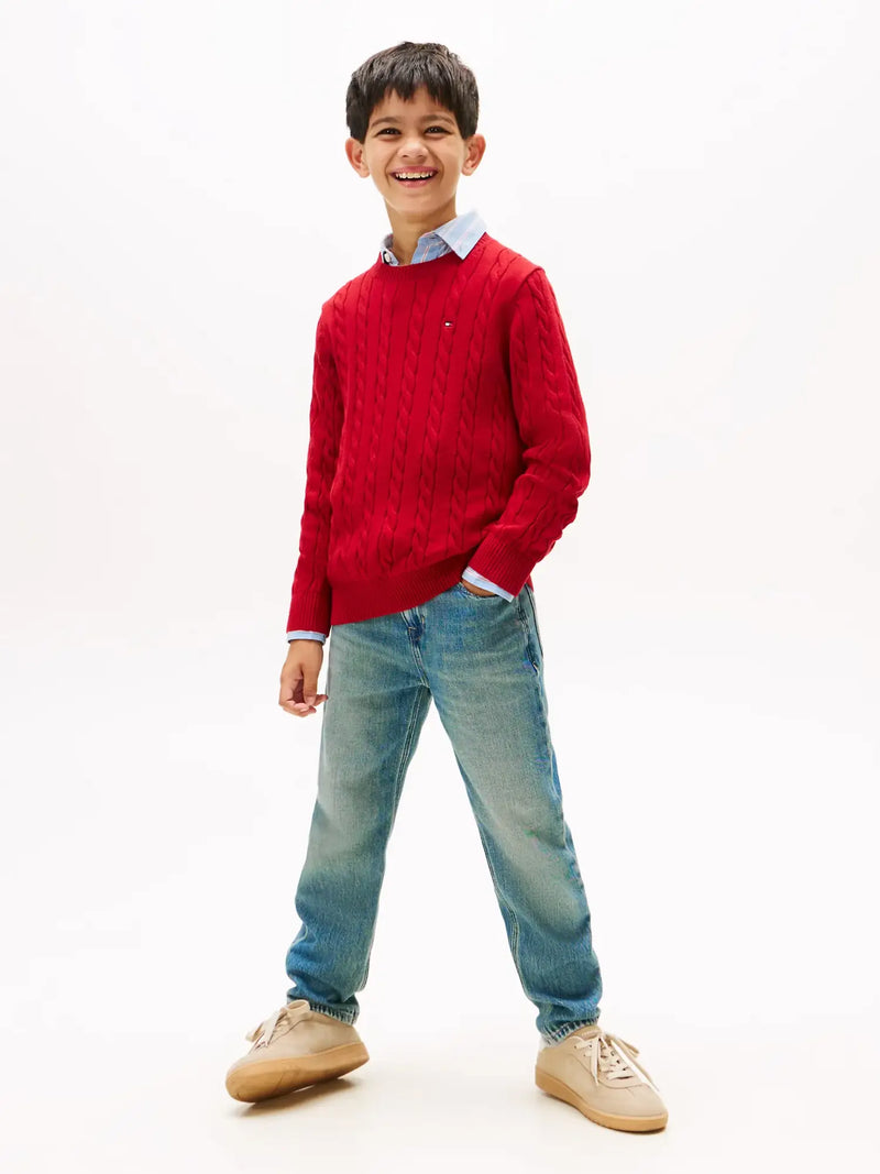 Boy wearing the Tommy Hilfiger cable knit sweater.